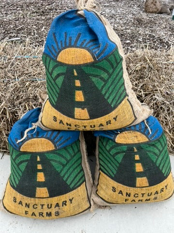 Three burlap bags of Sanctuary Farms compost