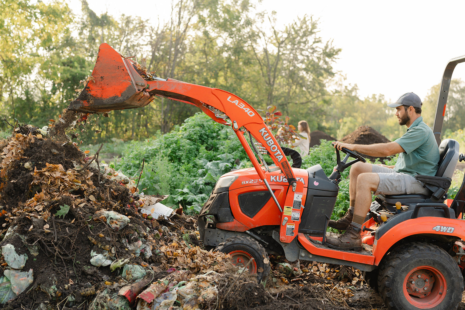 Parker Jean working the compost pile at Sanctuary Farms